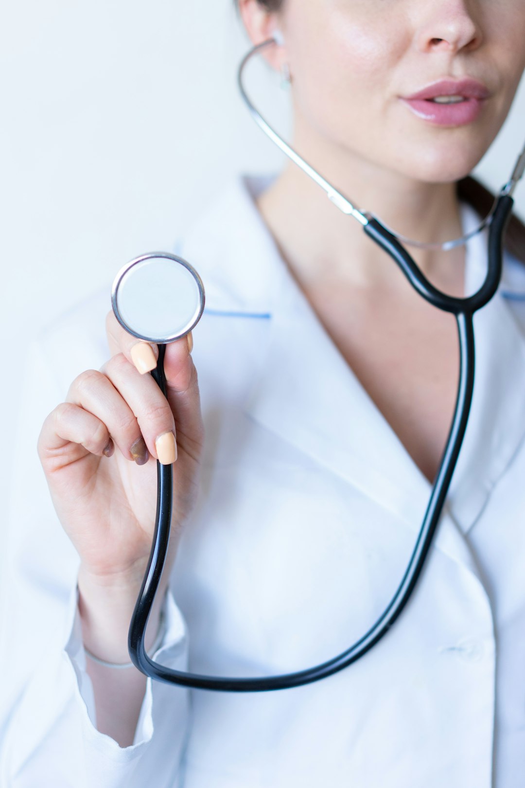 Accreditation readiness and sustainability Healthcare professional in white coat — accreditation readiness UAE