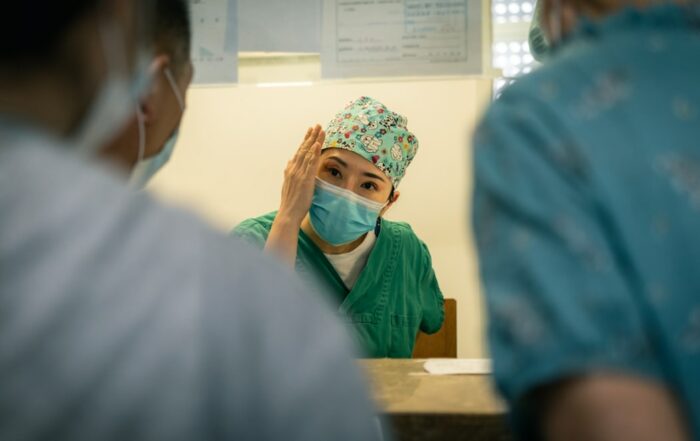 Nurse caring for a patient in a GCC hospital — nursing workforce retention